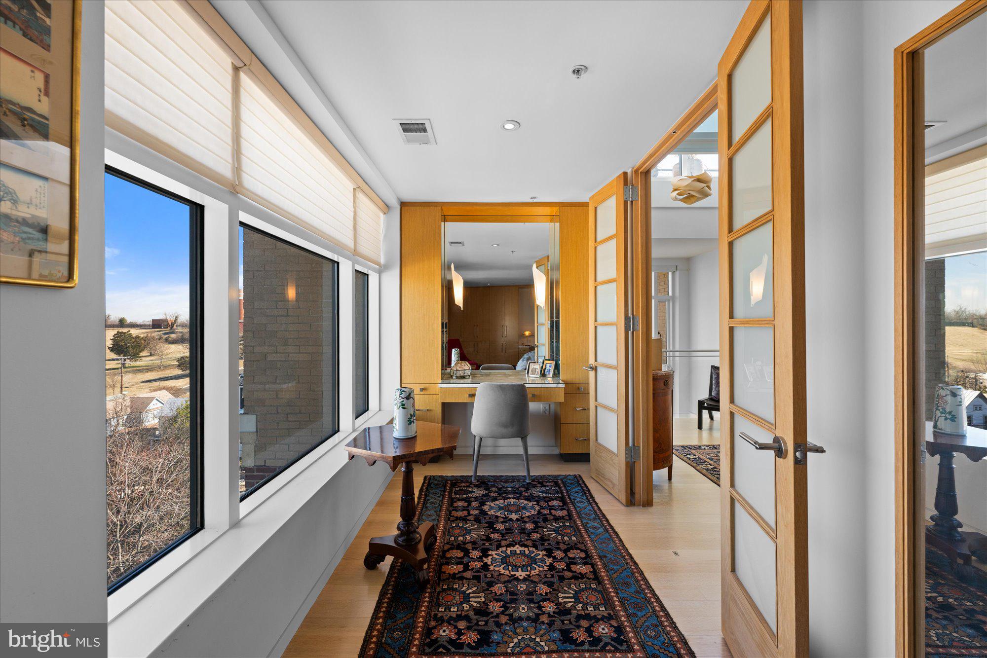4750 41st Street Northwest, Unit 507 Washington, DC 20016 - Photo 25 of 50 a bathroom with a large mirror a bathtub and a shower