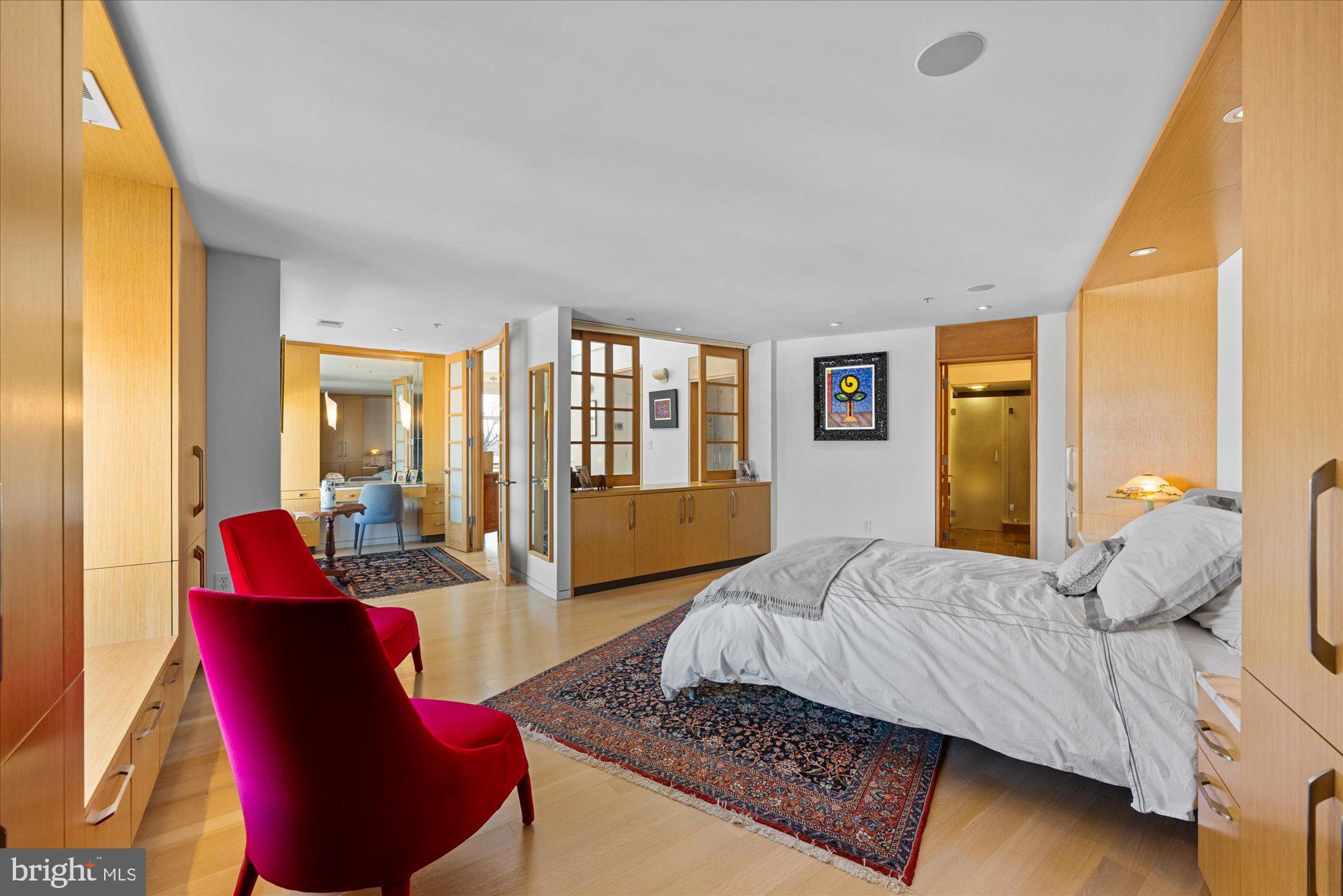 4750 41st Street Northwest, Unit 507 Washington, DC 20016 - Photo 26 of 50 a bedroom with furniture and a large window