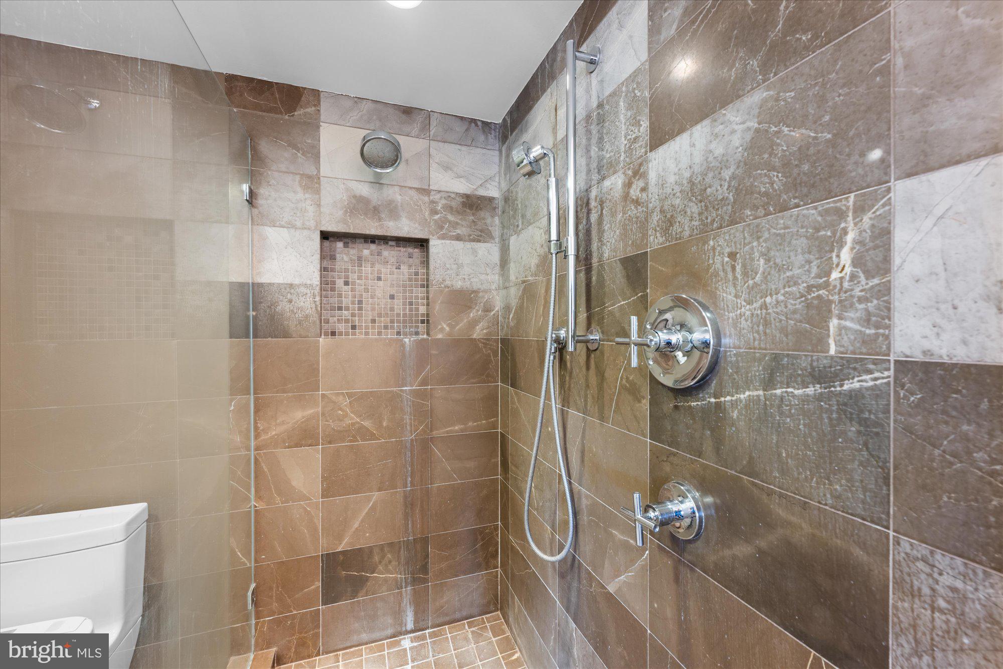 4750 41st Street Northwest, Unit 507 Washington, DC 20016 - Photo 30 of 50 a bathroom with a shower