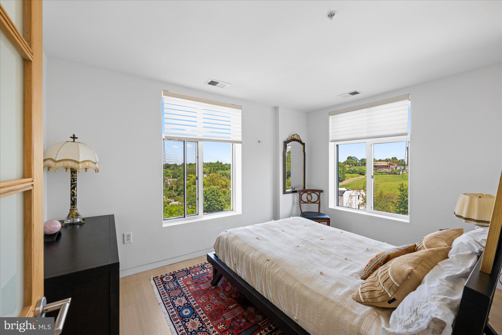 4750 41st Street Northwest, Unit 507 Washington, DC 20016 - Photo 31 of 50 a bedroom with a bed and a window