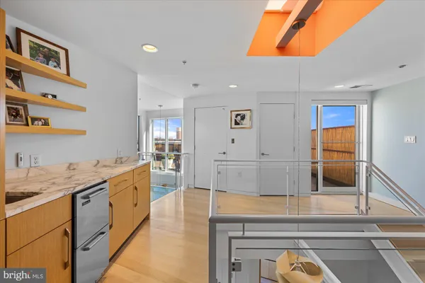 a kitchen with stainless steel appliances granite countertop a stove and a sink