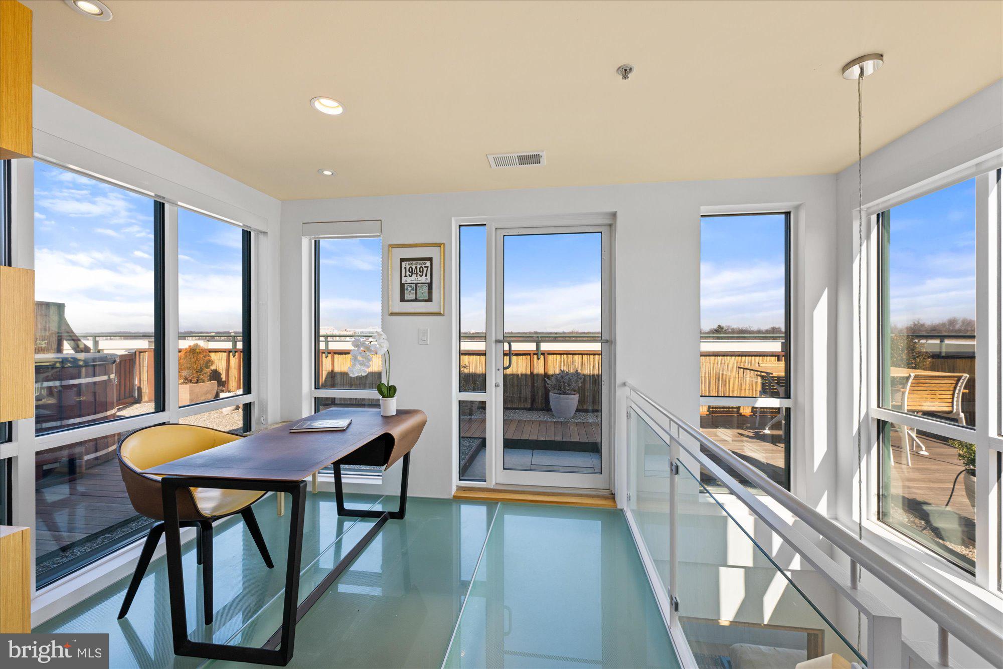 4750 41st Street Northwest, Unit 507 Washington, DC 20016 - Photo 40 of 50 a living room with furniture and a wooden floor