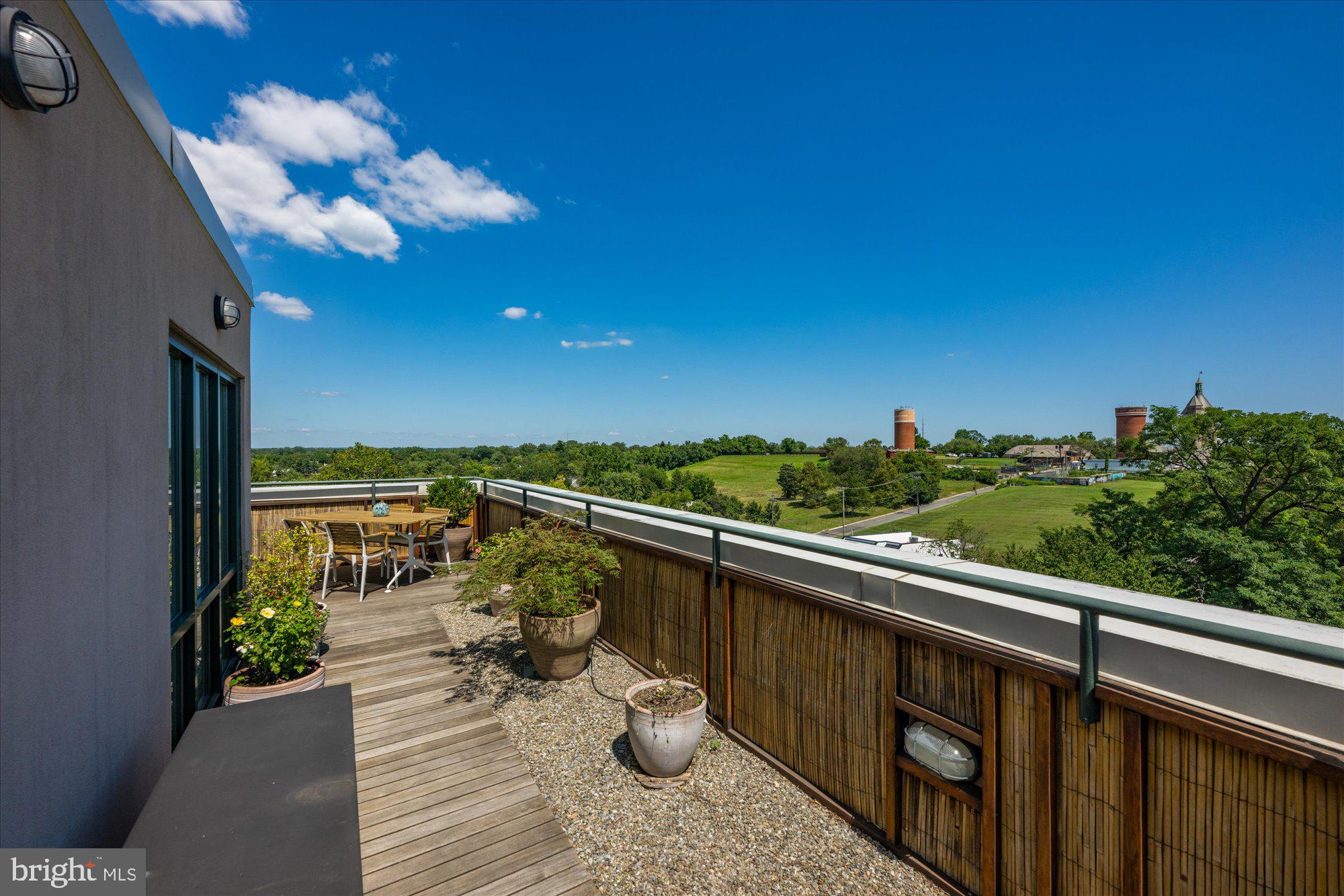 4750 41st Street Northwest, Unit 507 Washington, DC 20016 - Photo 45 of 50 a view of a balcony with chairs