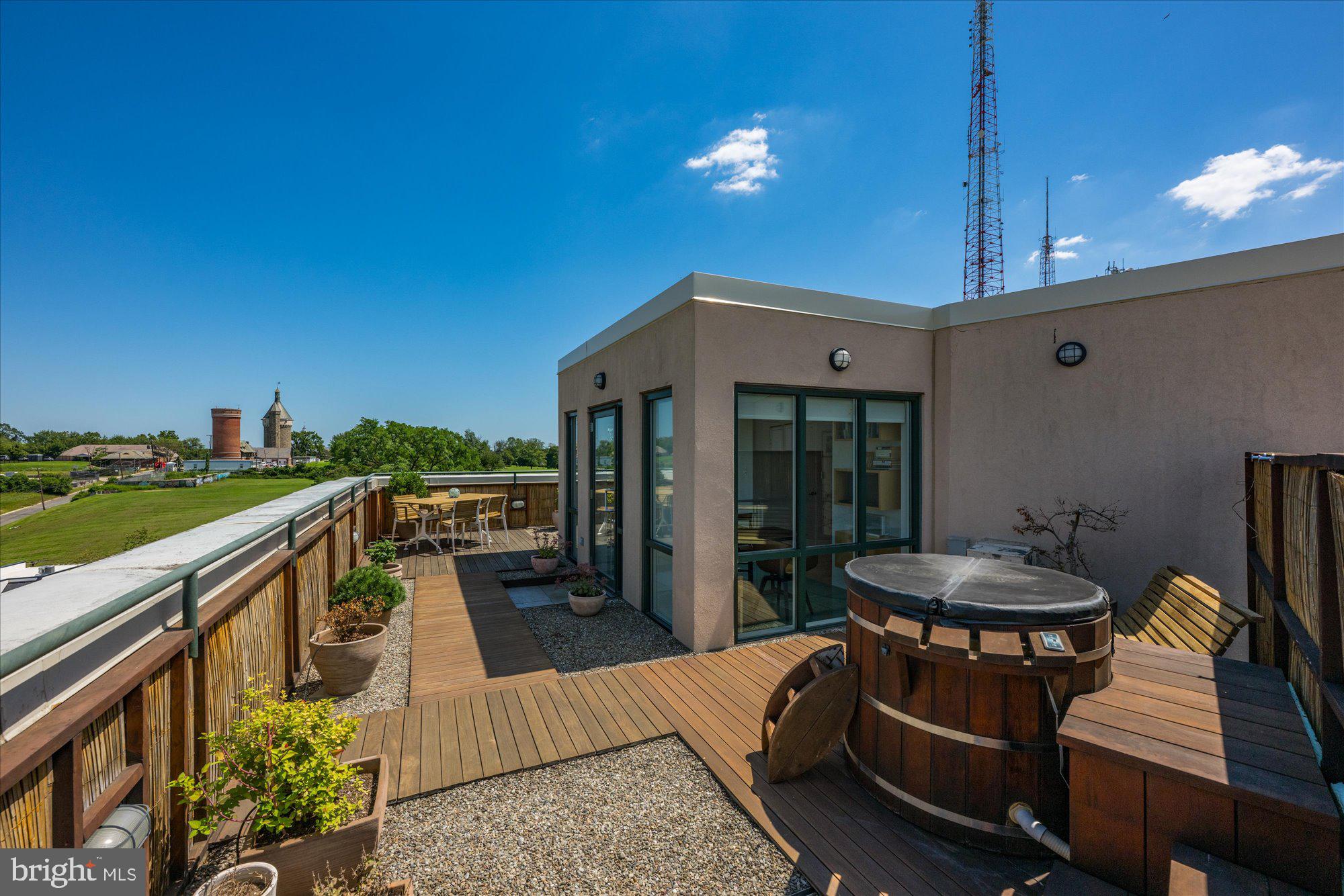 4750 41st Street Northwest, Unit 507 Washington, DC 20016 - Photo 48 of 50 a balcony with table and chairs