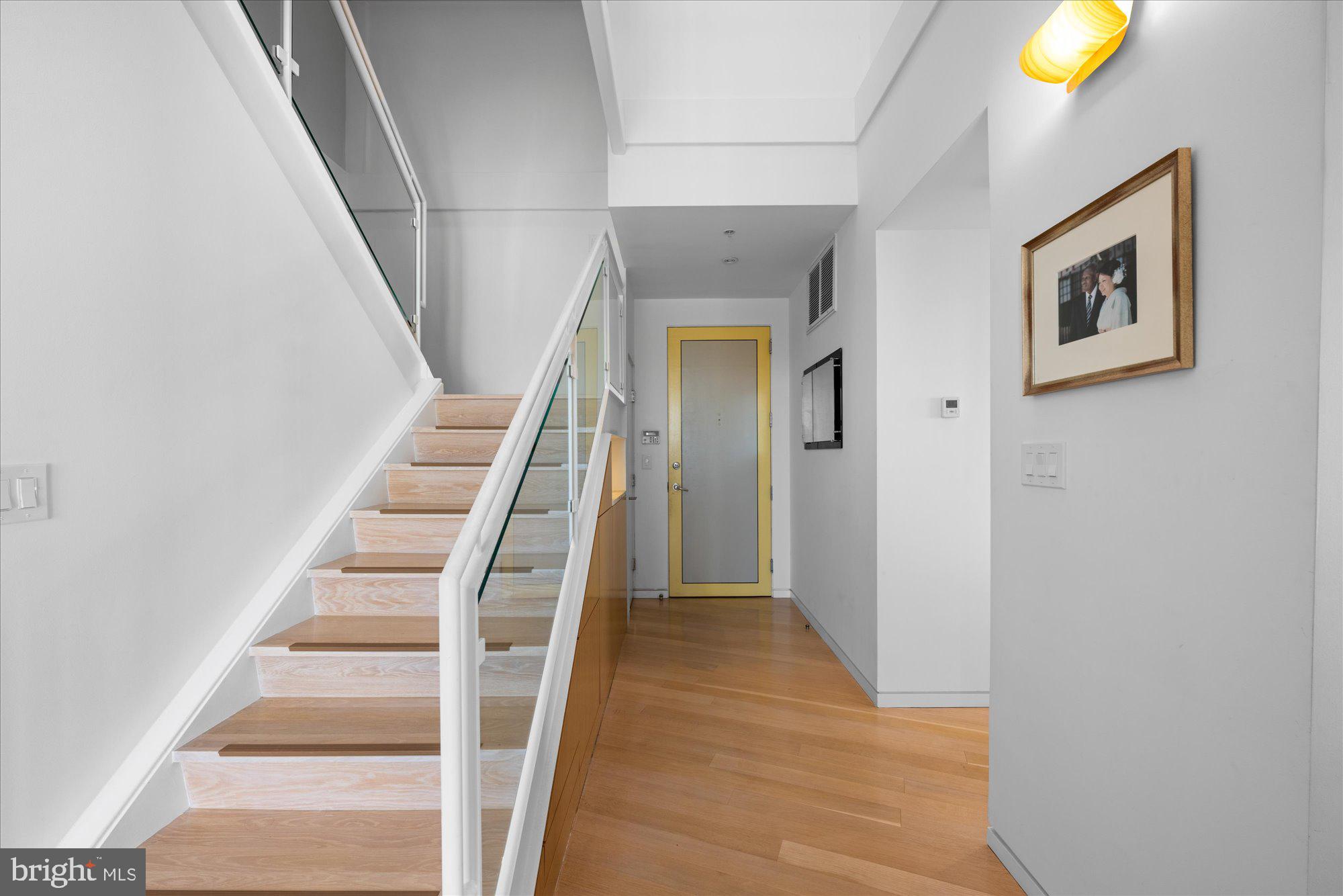 4750 41st Street Northwest, Unit 507 Washington, DC 20016 - Photo 5 of 50 a view of a hallway with wooden floor and entryway