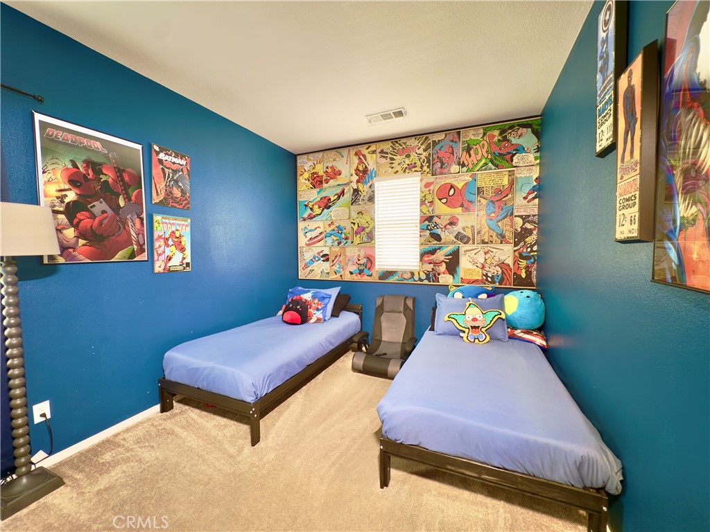 11265 Runyan Road Beaumont, CA 92223 - Photo 73 of 138 a bedroom with a bed and window