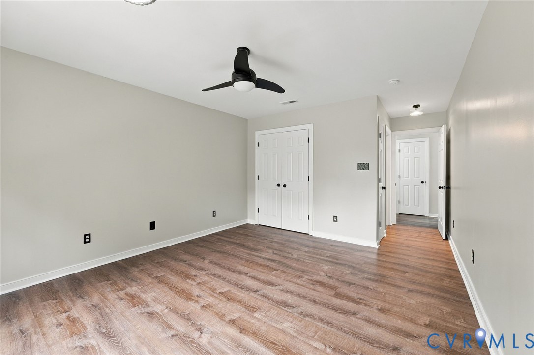 133 Ford Road Bumpass, VA 23024 - Photo 20 of 55 Wood-finish flooring, ceiling fan, white paneled d
