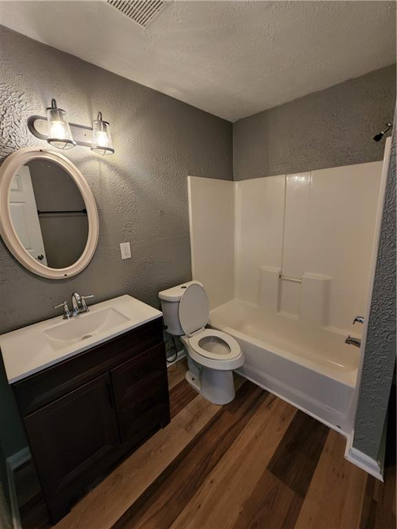 300 Overland Trail Temple, GA 30179 - Photo 12 of 35 a bathroom with a sink a toilet and a mirror
