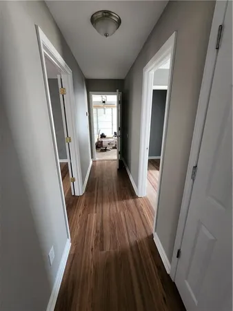 a bathroom with a toilet and a window