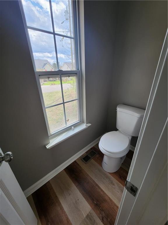 300 Overland Trail Temple, GA 30179 - Photo 18 of 35 a bathroom with a toilet and a window