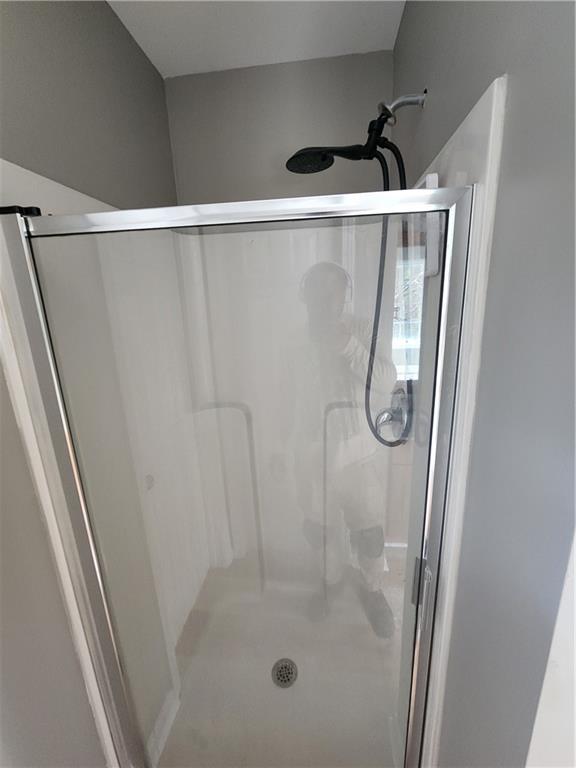 300 Overland Trail Temple, GA 30179 - Photo 20 of 35 a bathroom with a glass shower door