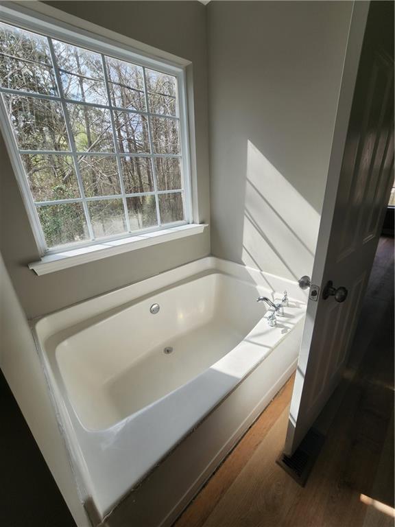 300 Overland Trail Temple, GA 30179 - Photo 21 of 35 a bathroom with a bathtub and next to a window