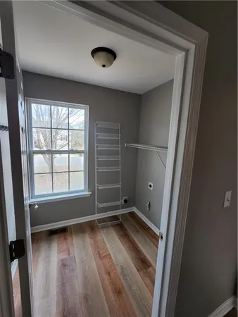 a kitchen with stainless steel appliances a stove a microwave and a refrigerator