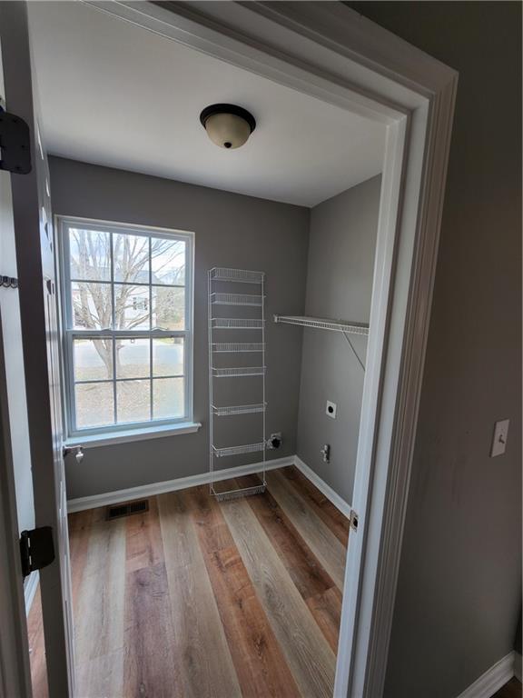300 Overland Trail Temple, GA 30179 - Photo 31 of 35 an empty room with wooden floor and windows
