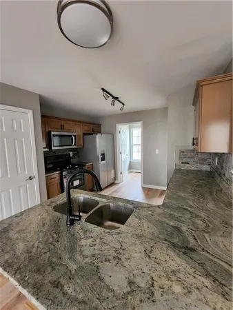a view of a kitchen with a sink