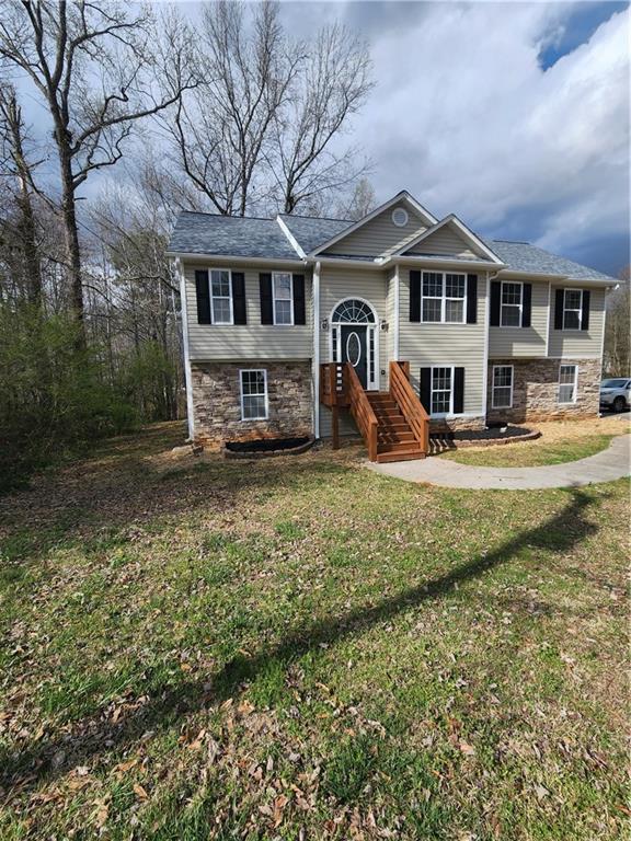 300 Overland Trail Temple, GA 30179 - Photo 5 of 35 a front view of a residential houses with yard and trees