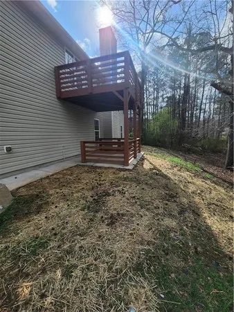 a view of a backyard with large trees