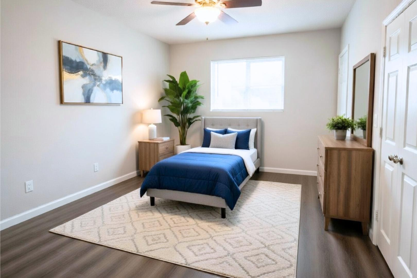 9230 North 6th Street, Unit 9 Phoenix, AZ 85020 - Photo 7 of 7 a bedroom with a large bed and a chandelier