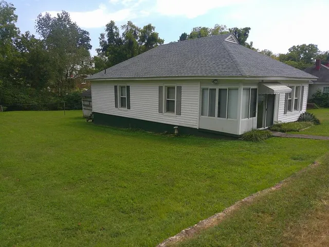 a view of a house with a garden