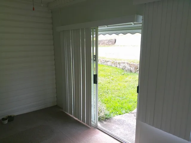 a view of a room with a large window