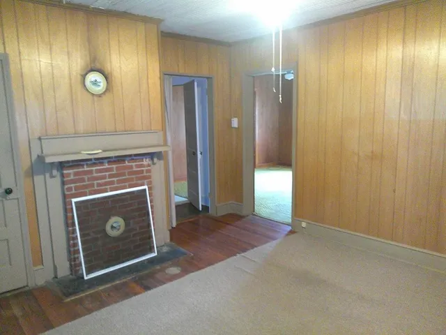 a view of an entryway door with wooden door