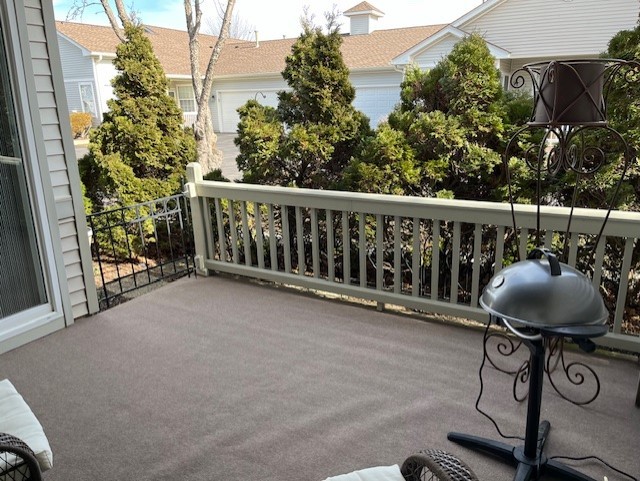 12242 Quail Ridge Drive Huntley, IL 60142 - Photo 8 of 13 a view of balcony with wooden floor and outdoor seating
