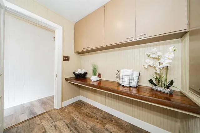 a kitchen with a sink and cabinets
