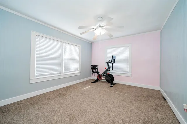 a view of room with workspace and windows