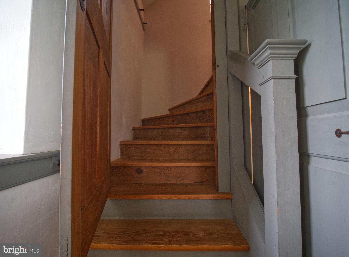 784 Coffee Run Road Reedsville, PA 17084 - Photo 18 of 48 a view of staircase with white walls and a window