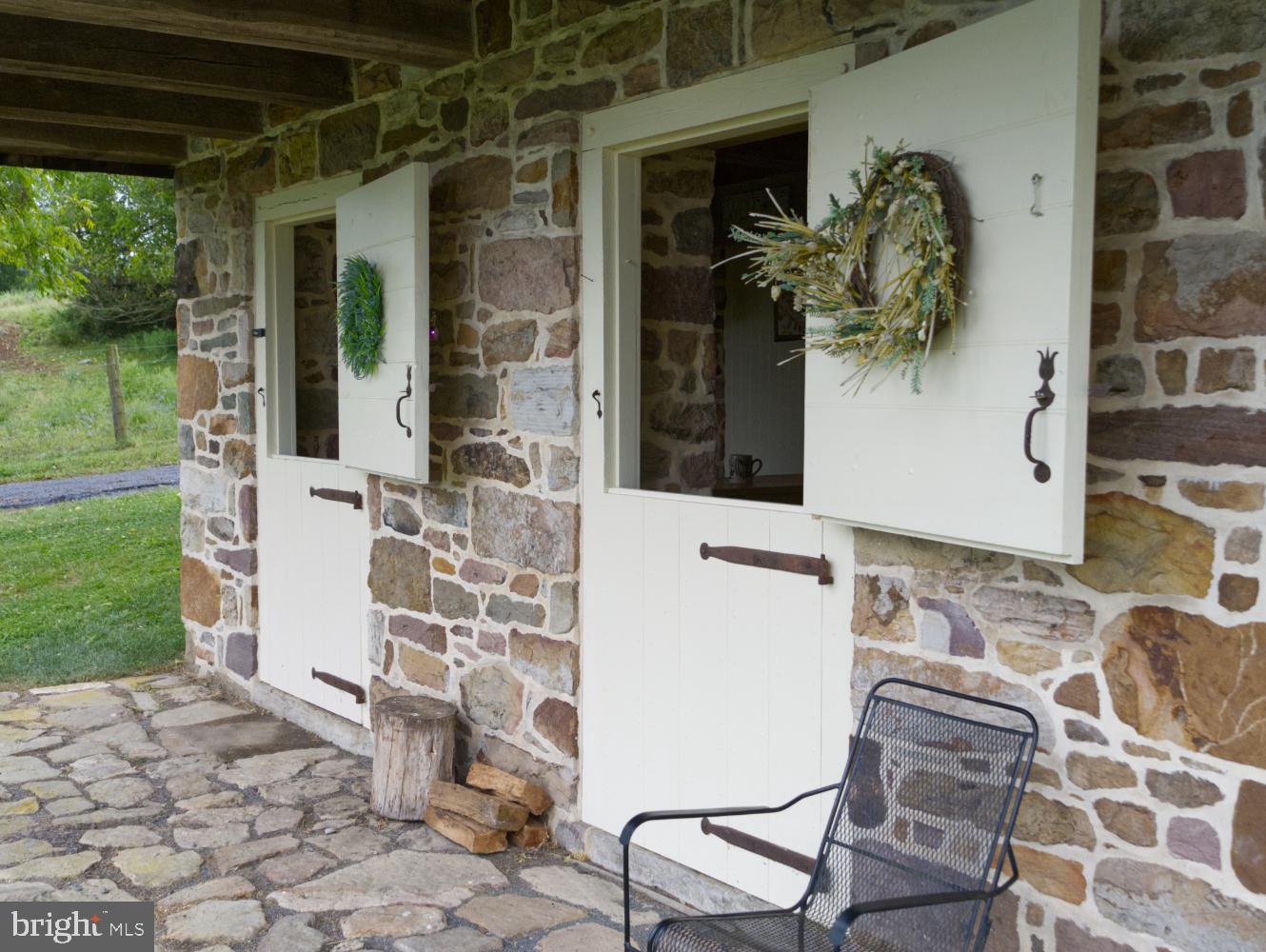 784 Coffee Run Road Reedsville, PA 17084 - Photo 30 of 48 a front view of a house with garden
