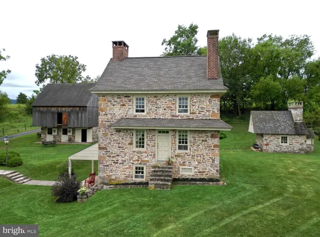 a view of a house with a yard porch and sitting area