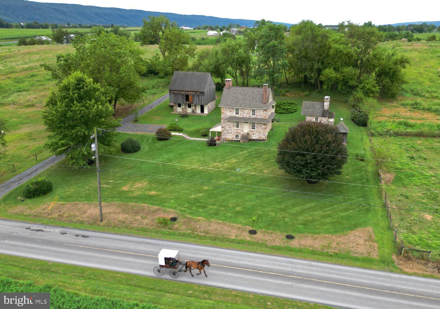 784 Coffee Run Road Reedsville, PA 17084 - Photo 48 of 48 a backyard of a house with table and chairs