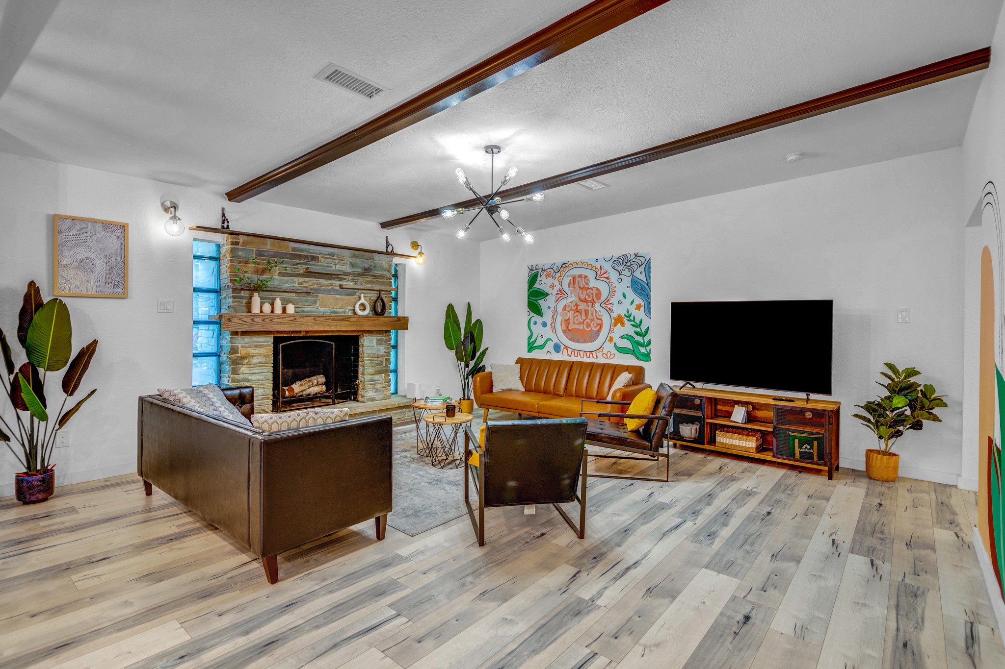 5918 Lattimer Drive Houston, TX 77035 - Photo 1 of 35 a living room with furniture a flat screen tv and a fireplace