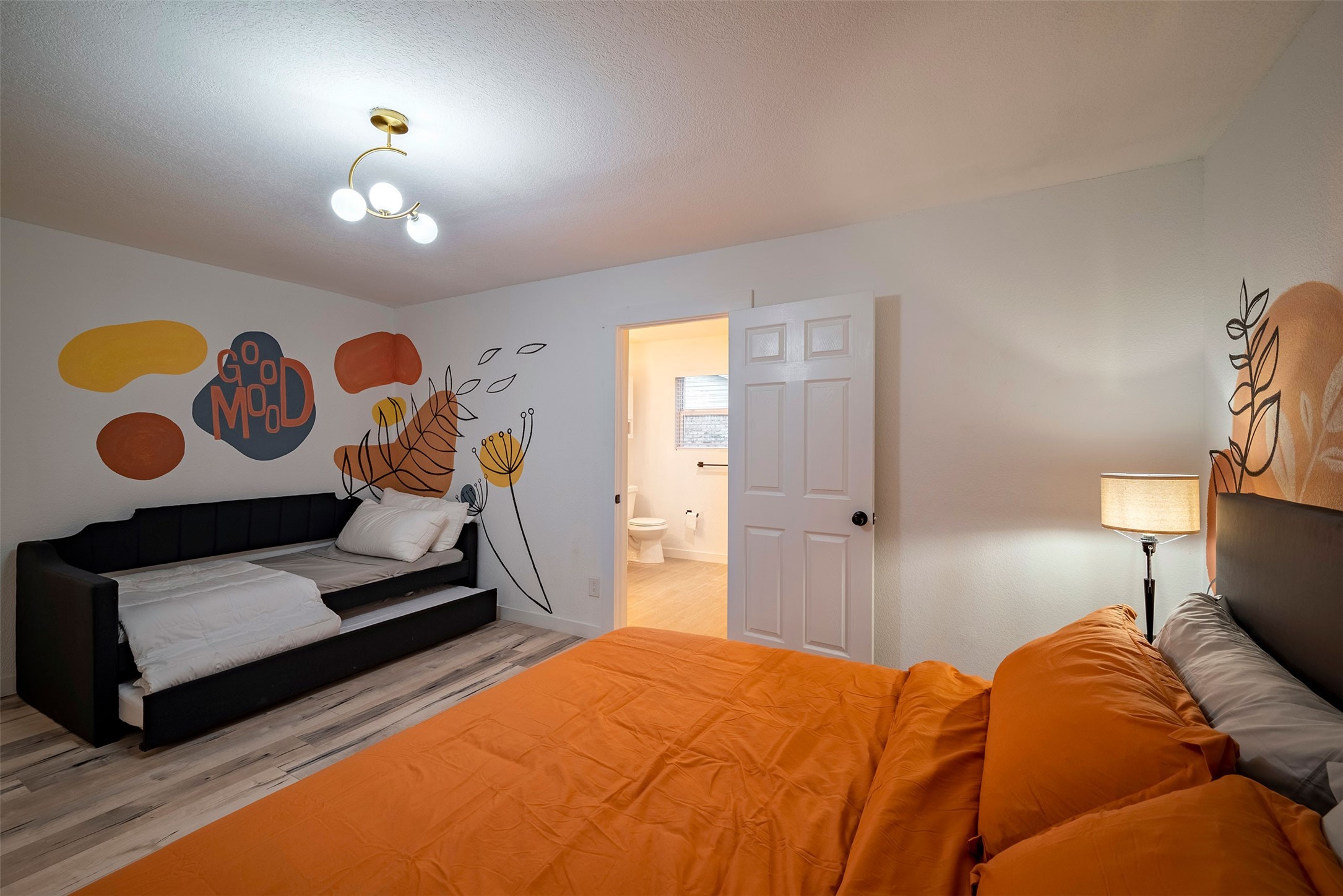 5918 Lattimer Drive Houston, TX 77035 - Photo 18 of 35 a bedroom with a bed and a lamp on dresser