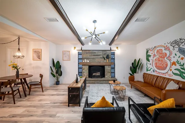 a living room with furniture and a fireplace