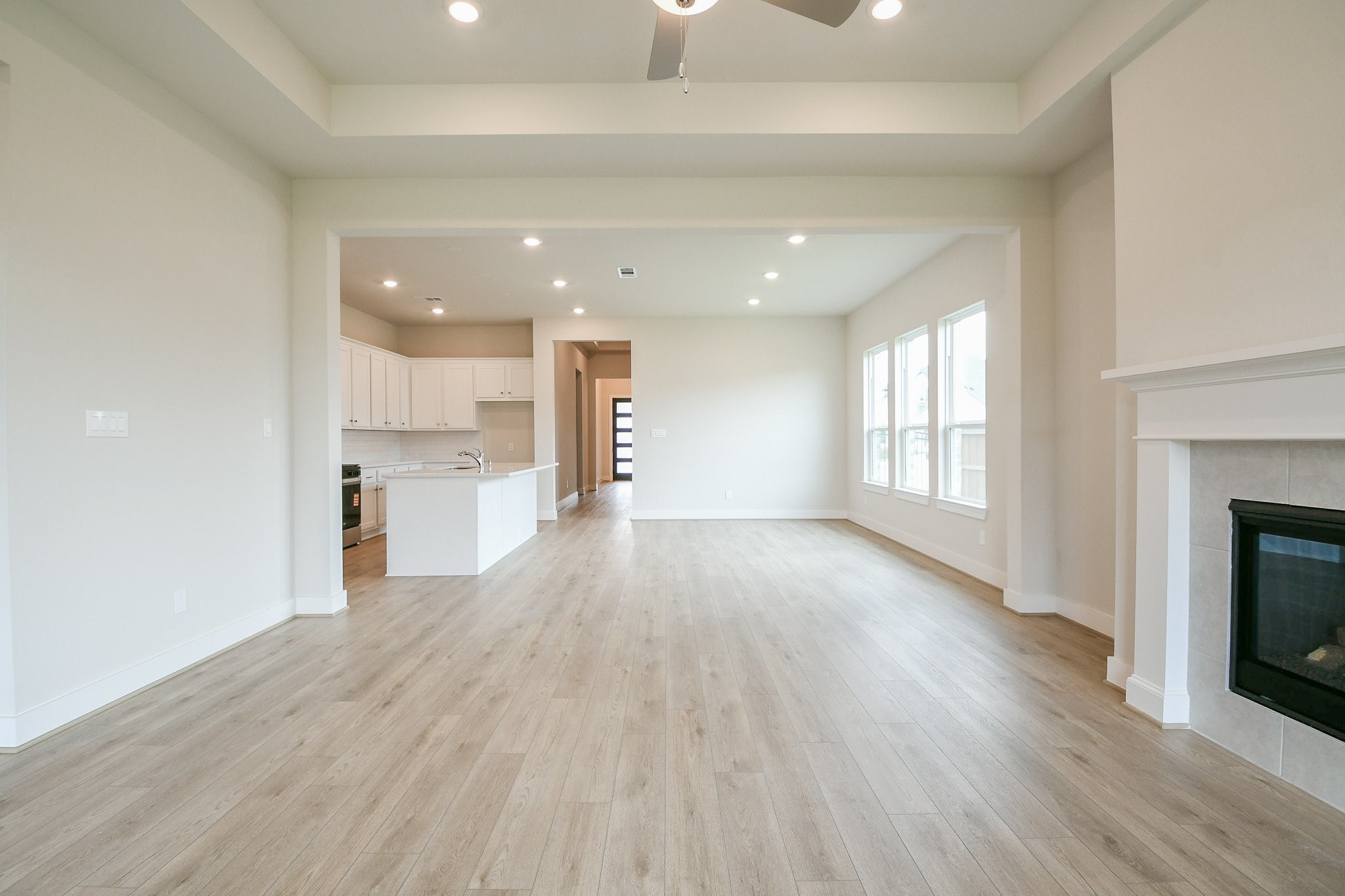 5005 Vly Wind Court Spring, TX 77386 - Photo 11 of 20 a view of empty room with wooden floor and fireplace