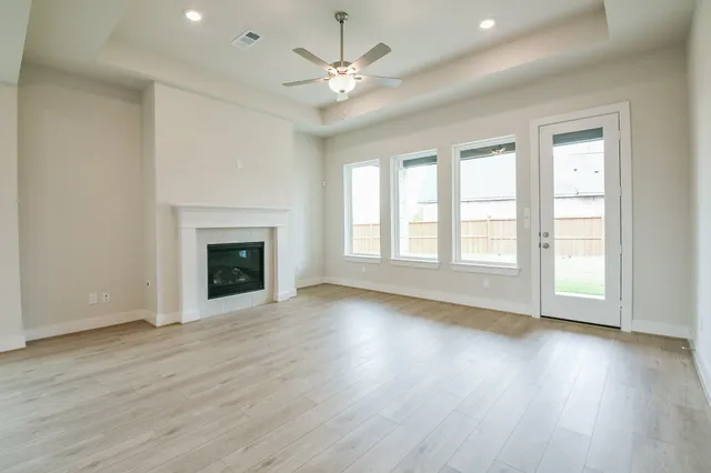 a kitchen with stainless steel appliances granite countertop a lot of counter space and wooden floors