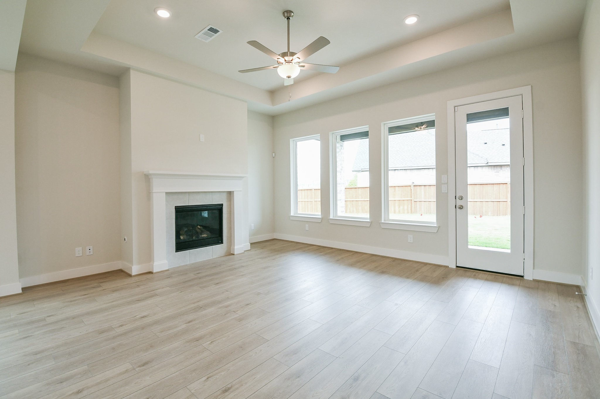 5005 Vly Wind Court Spring, TX 77386 - Photo 12 of 20 a view of an empty room with wooden floor and a window