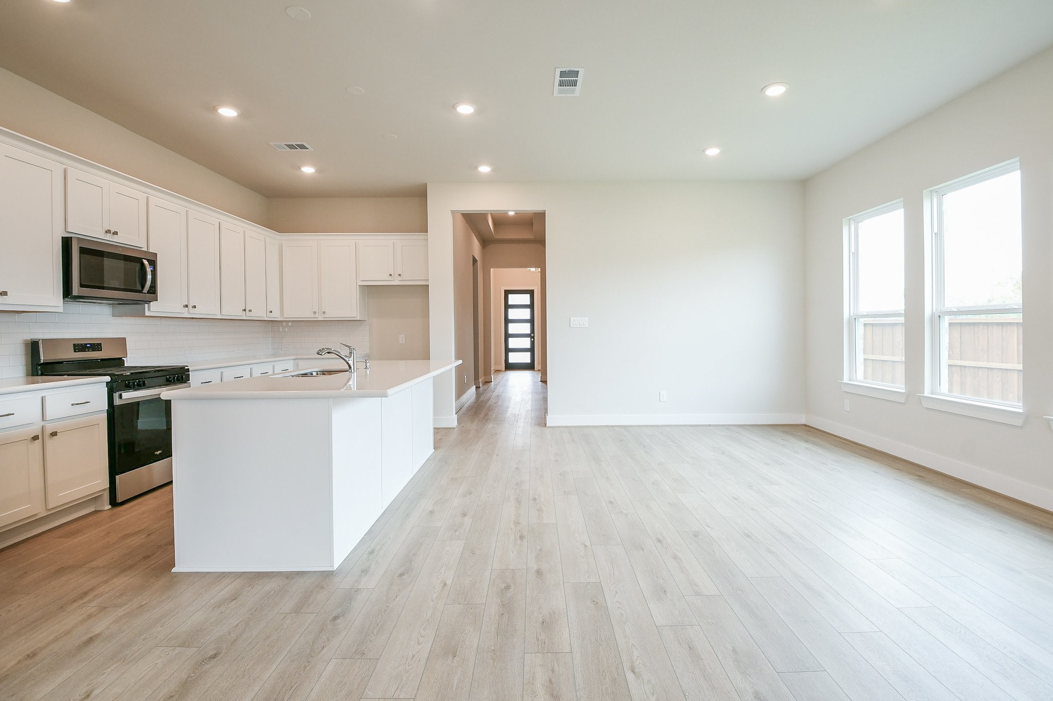 5005 Vly Wind Court Spring, TX 77386 - Photo 15 of 20 a large kitchen with stainless steel appliances granite countertop a stove a sink and a microwave