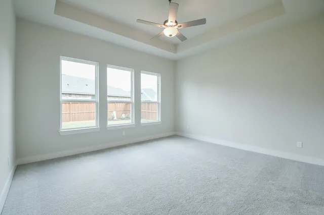 a spacious bathroom with a double vanity sink a mirror and a bathtub