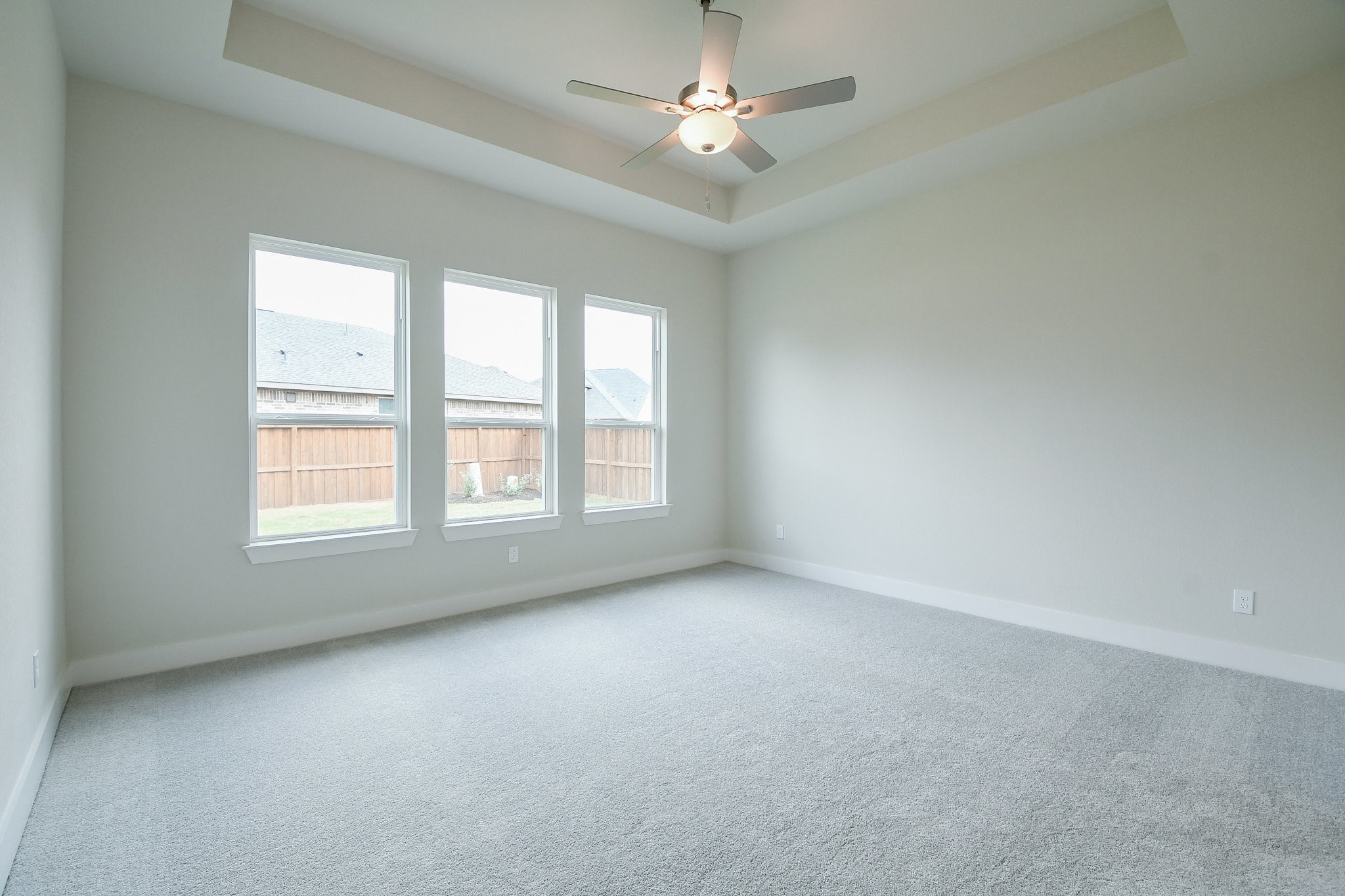 5005 Vly Wind Court Spring, TX 77386 - Photo 6 of 20 an empty room with a window and a ceiling fan
