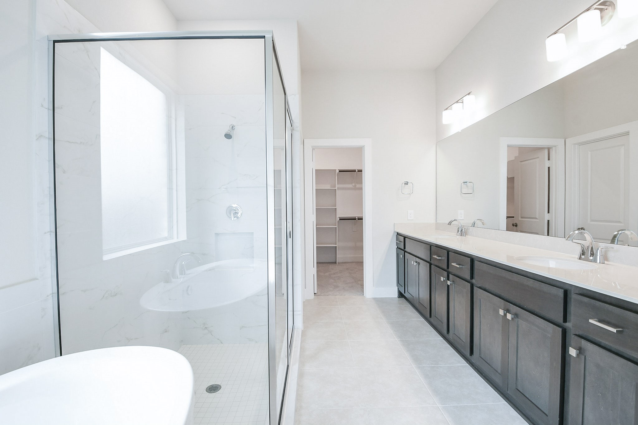 5005 Vly Wind Court Spring, TX 77386 - Photo 9 of 20 a spacious bathroom with a double vanity sink and a mirror