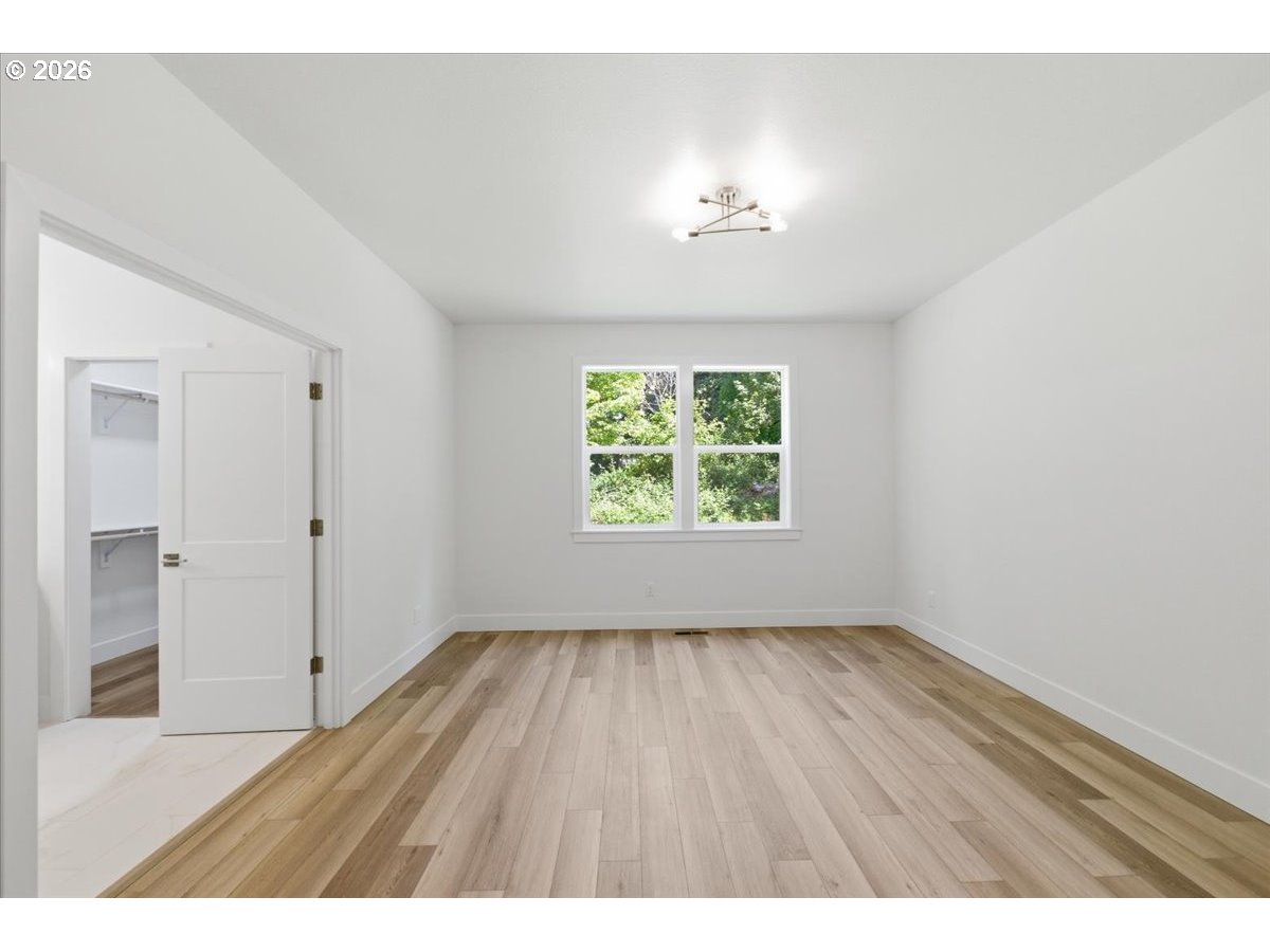 2147 Northeast Spitz Road Canby, OR 97013 - Photo 22 of 48 wooden floor in an empty room with a window