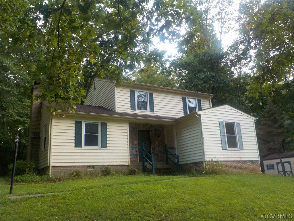 10332 Spring Run Road Chesterfield, VA 23832 - Photo 2 of 18 a front view of a house with a garden