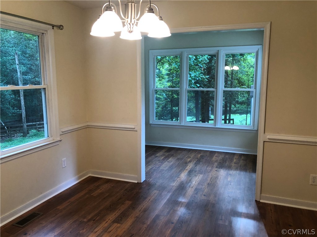 10332 Spring Run Road Chesterfield, VA 23832 - Photo 10 of 18 an empty room with wooden floor and windows