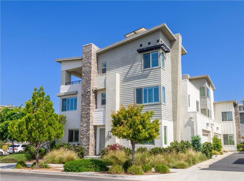 a view of a house with a yard and plants