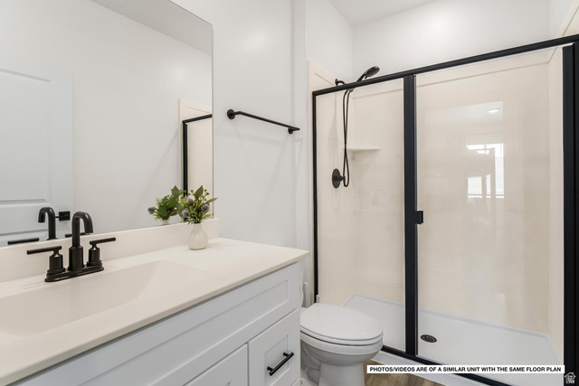 1702 Ripple Rock Drive, Unit 3171 Washington, UT 84780 - Photo 13 of 16 Bathroom featuring a white vanity with a light-colored countertop and undermount sink