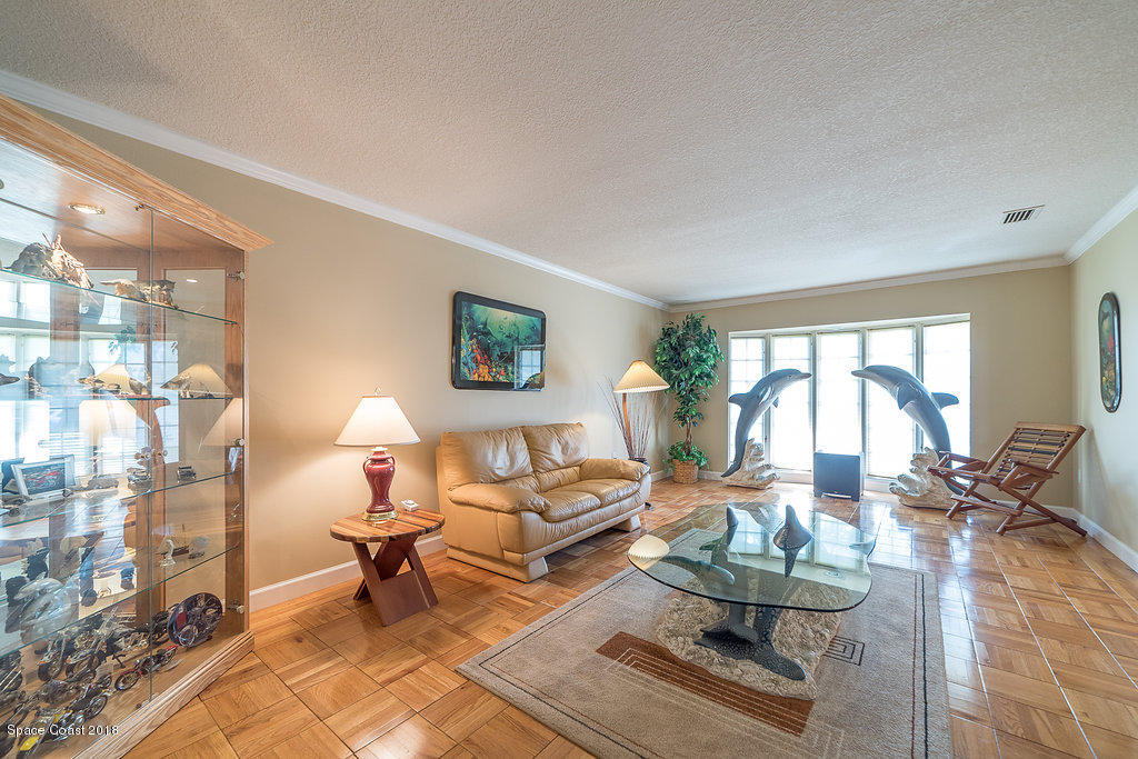 1401 Meadowbrook Road Northeast Palm Bay, FL 32905 - Photo 33 of 46 a living room with furniture and a large window