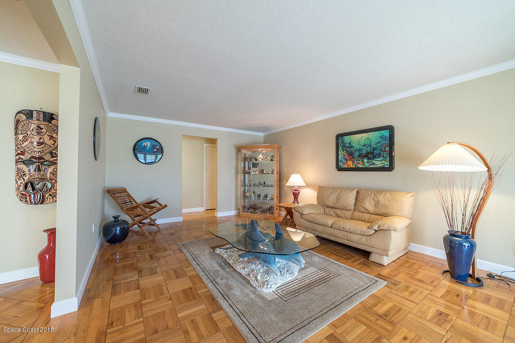 1401 Meadowbrook Road Northeast Palm Bay, FL 32905 - Photo 34 of 46 a living room with furniture and a window
