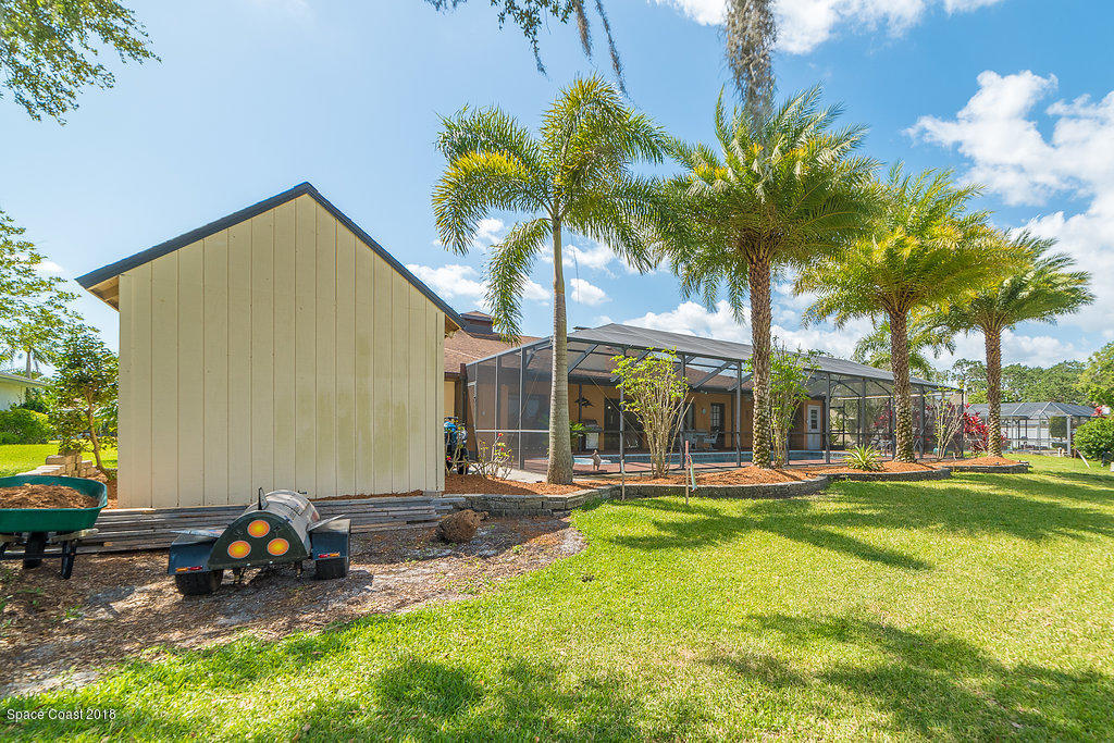 1401 Meadowbrook Road Northeast Palm Bay, FL 32905 - Photo 36 of 46 a view of a house with swimming pool and sitting area
